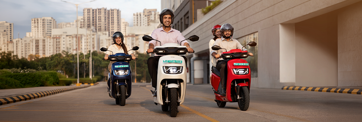  Rider riding VIDA electric scooter after charging it.