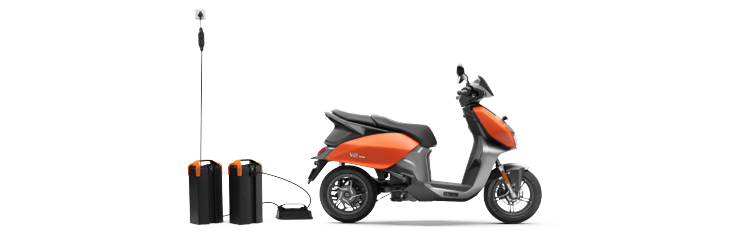  Rider riding VIDA electric scooter after charging it.