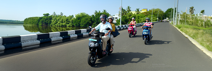  Rider riding VIDA electric scooter after charging it.
