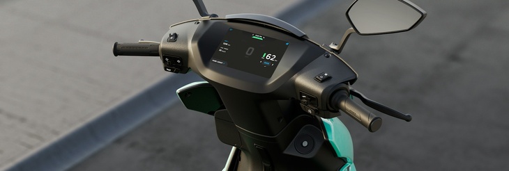  Rider riding VIDA electric scooter after charging it.