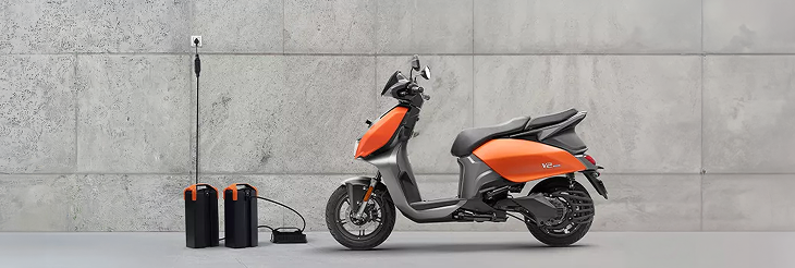  Rider riding VIDA electric scooter after charging it.