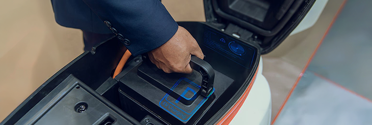  Rider riding VIDA electric scooter after charging it.