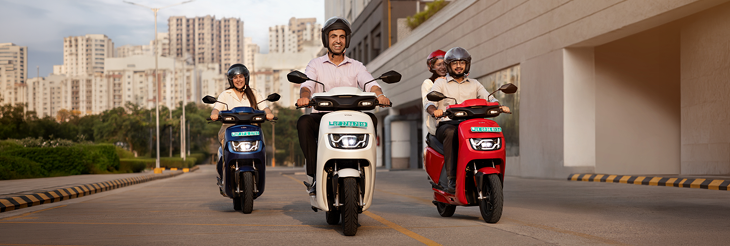  Rider riding VIDA electric scooter after charging it.