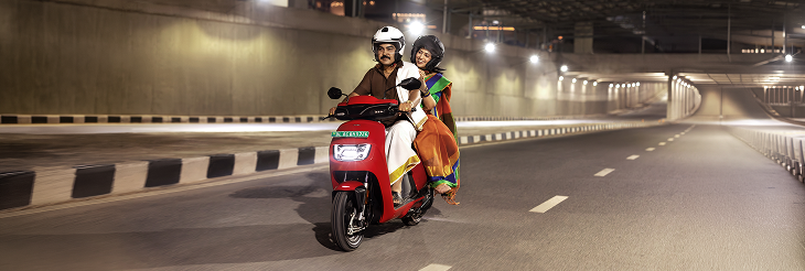  Rider riding VIDA electric scooter after charging it.