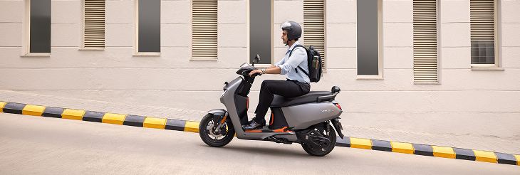  Rider riding VIDA electric scooter after charging it.