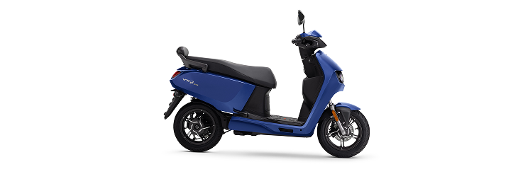  Rider riding VIDA electric scooter after charging it.