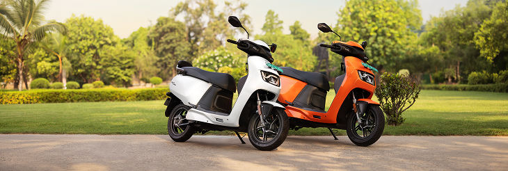  Rider riding VIDA electric scooter after charging it.