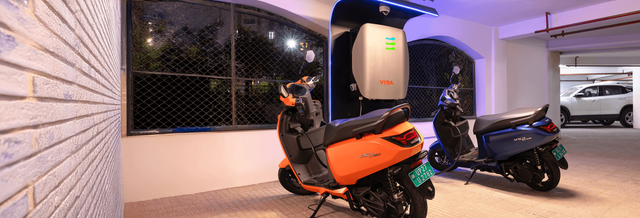  Rider riding VIDA electric scooter after charging it.