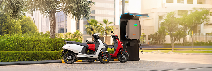  Rider riding VIDA electric scooter after charging it.