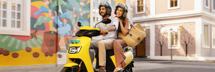  Rider riding VIDA electric scooter after charging it.