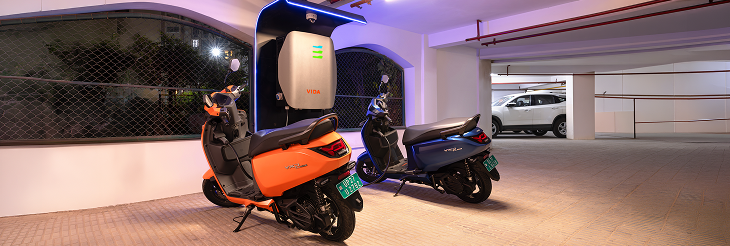  Rider riding VIDA electric scooter after charging it.