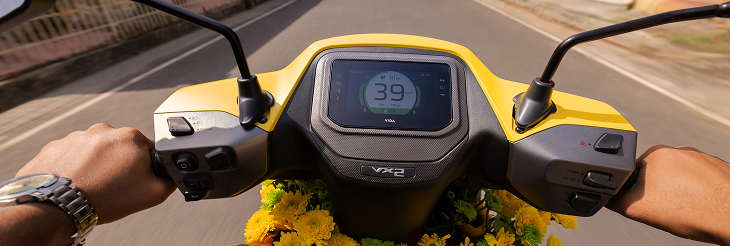  Rider riding VIDA electric scooter after charging it.