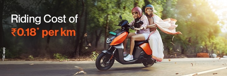 An image showing Two people are riding VIDA electric scooter showing daily savings on travel costs